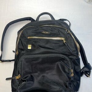 Tumi Black Backpack with Gold Accents